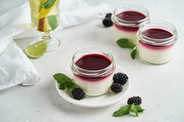 Sugar- and lactose-free coconut keto panna cotta with blackberry topping